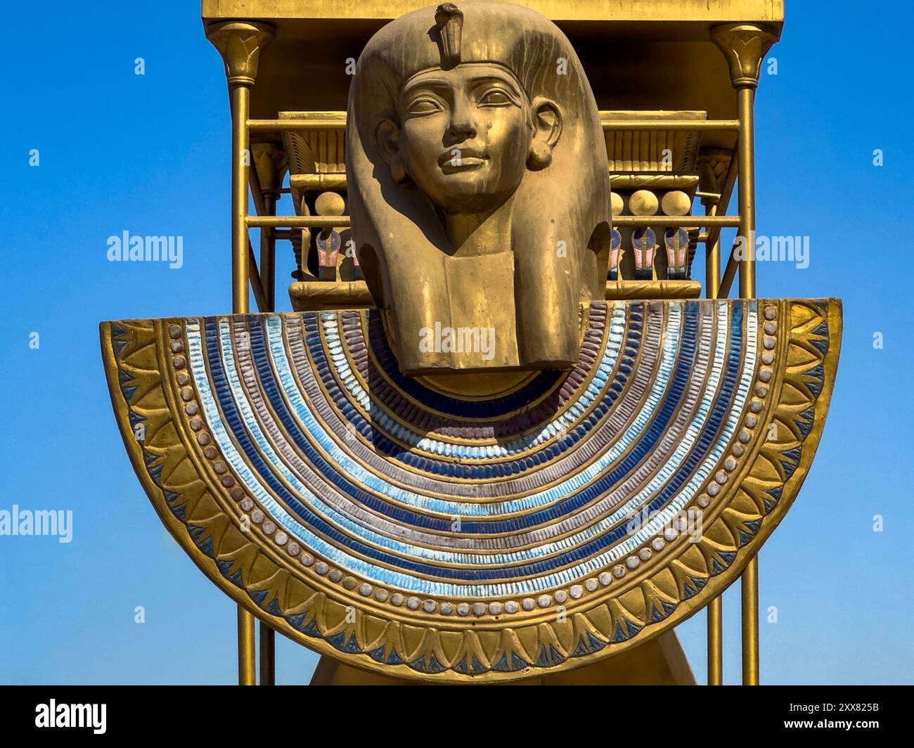 The solar boat, guided by the divine head of Ra, the sun god, embarks on a sacred journey across the Nile. This image represents the eternal cycle. Stock Photo