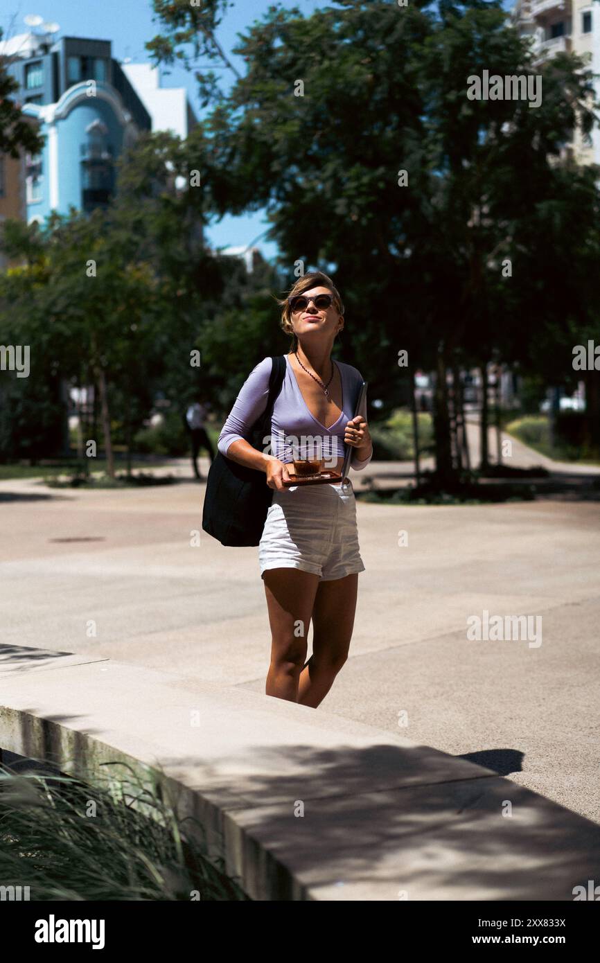 Woman laptop walks in campus hi-res stock photography and images - Alamy