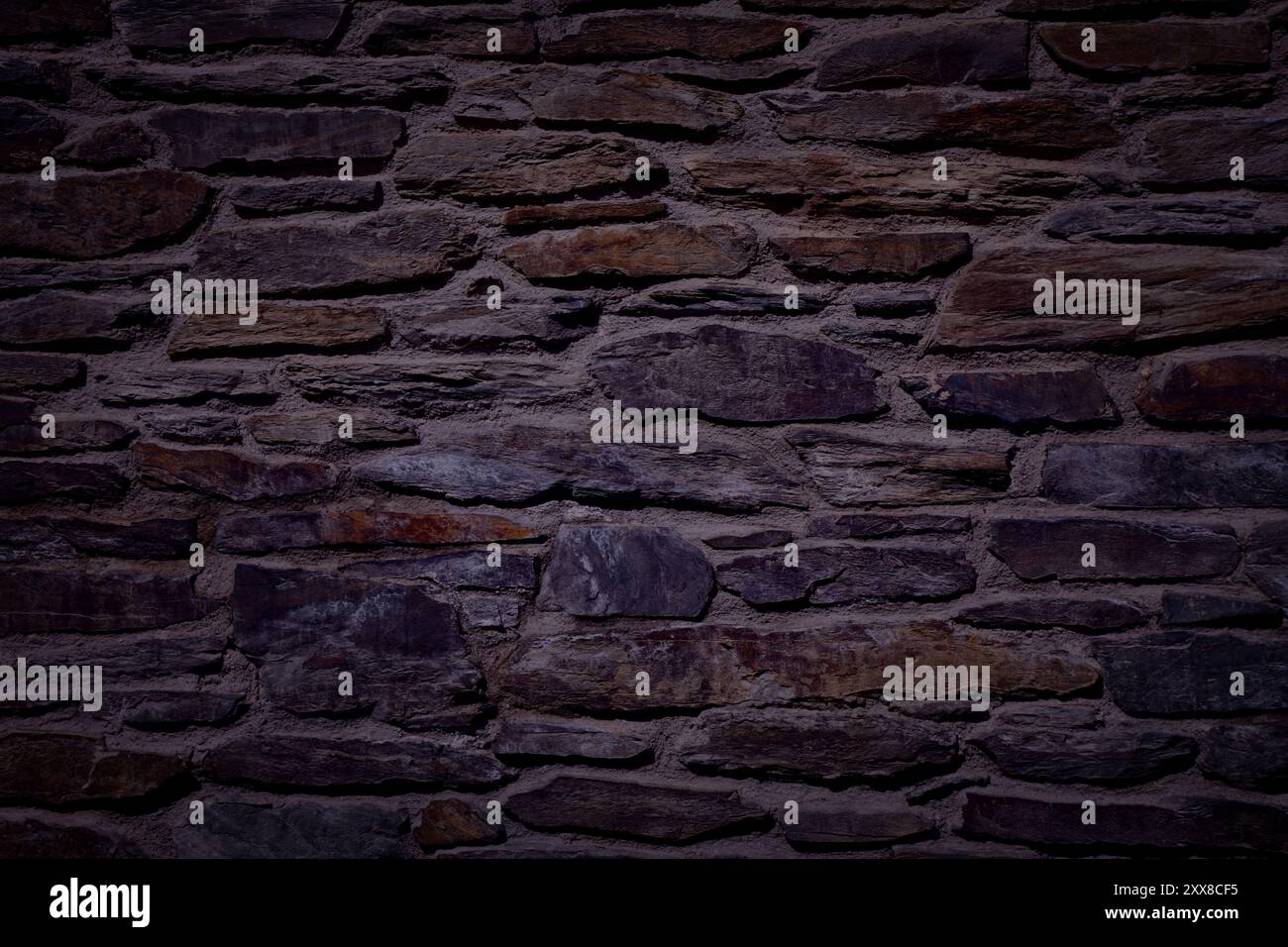 Dark wall texture. Black night stone wall background. Stock Photo
