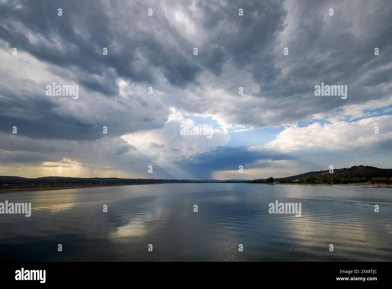 landscape with rain clouds above a lake Stock Photo - Alamy