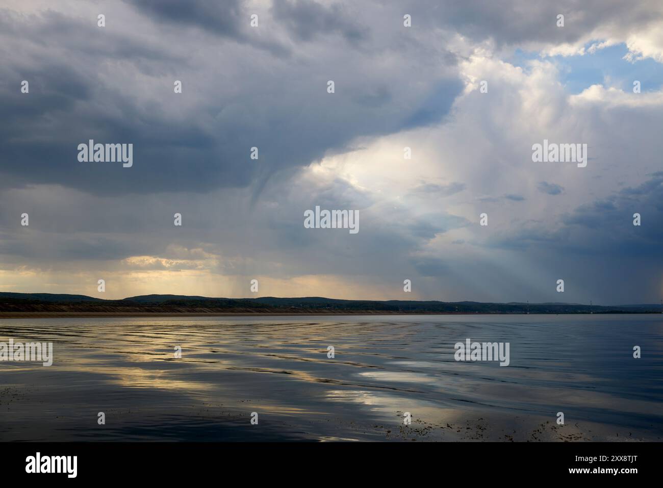 landscape with rain clouds above a lake Stock Photo - Alamy