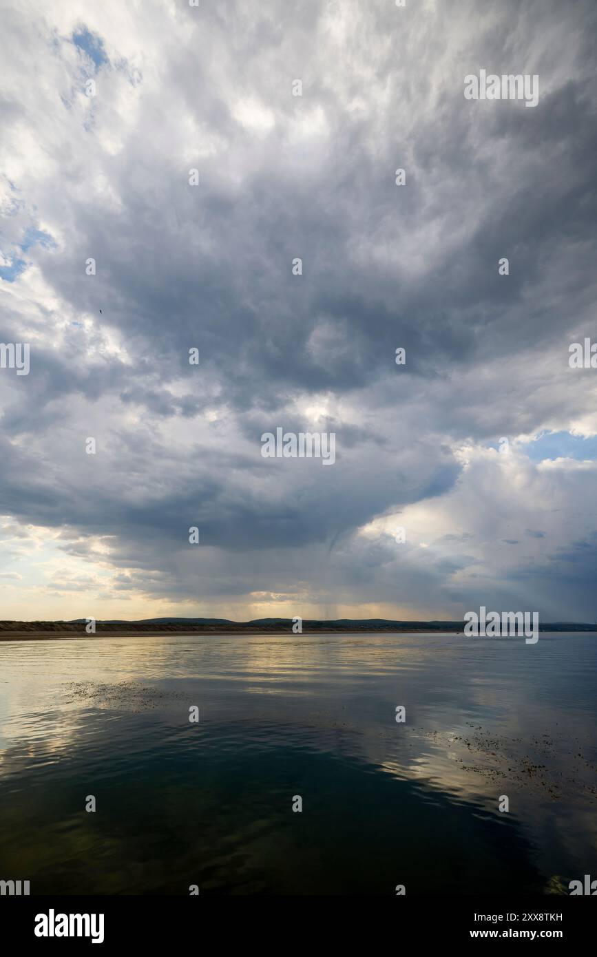 landscape with rain clouds above a lake Stock Photo - Alamy