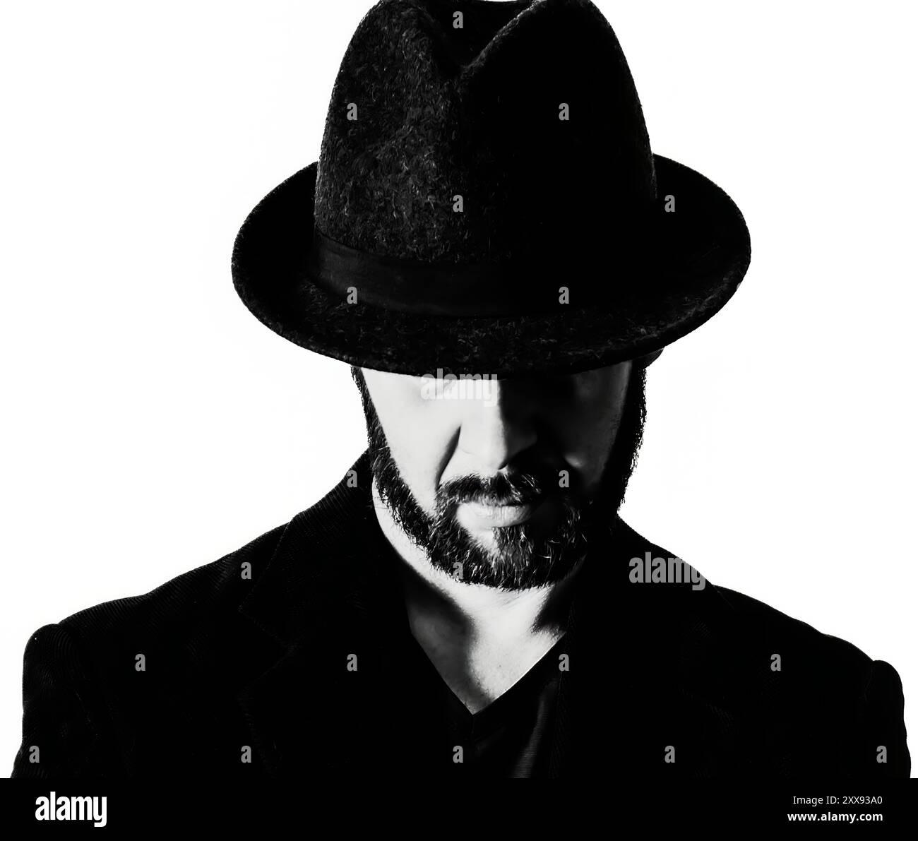 Monochrome Headshot Self-Portrait with Fedora and Dramatic Lighting Stock Photo