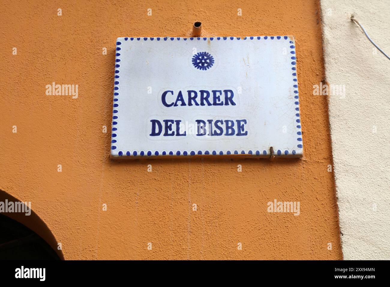 Alghero town in Sardinia island, Italy. Street name sign in Catalan ...