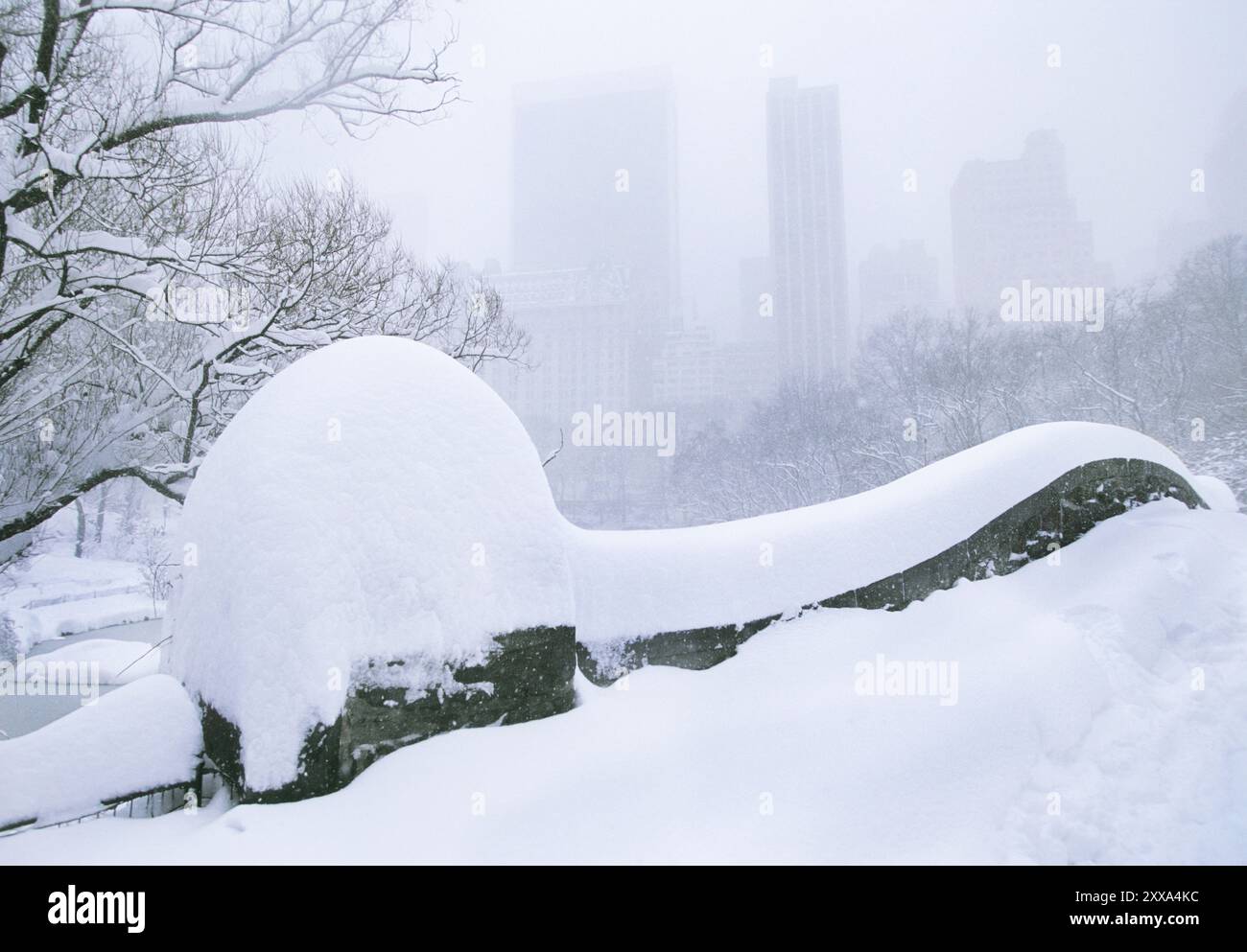 Central Park Gapstow Bridge in New York City during a snowstorm. Snow ...