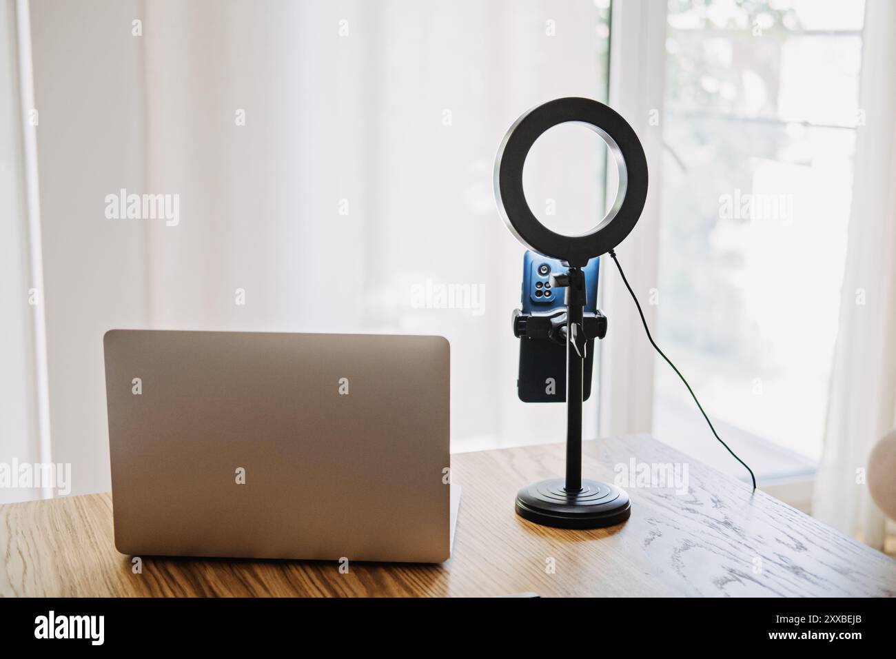 Home video recording setup with laptop and ring light, content creation ...
