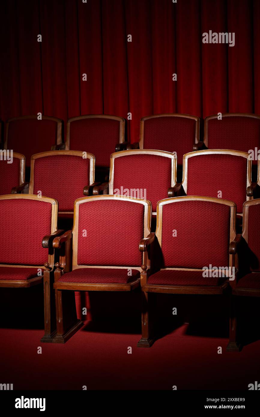 Empty red theater seats under a red curtain Stock Photo - Alamy