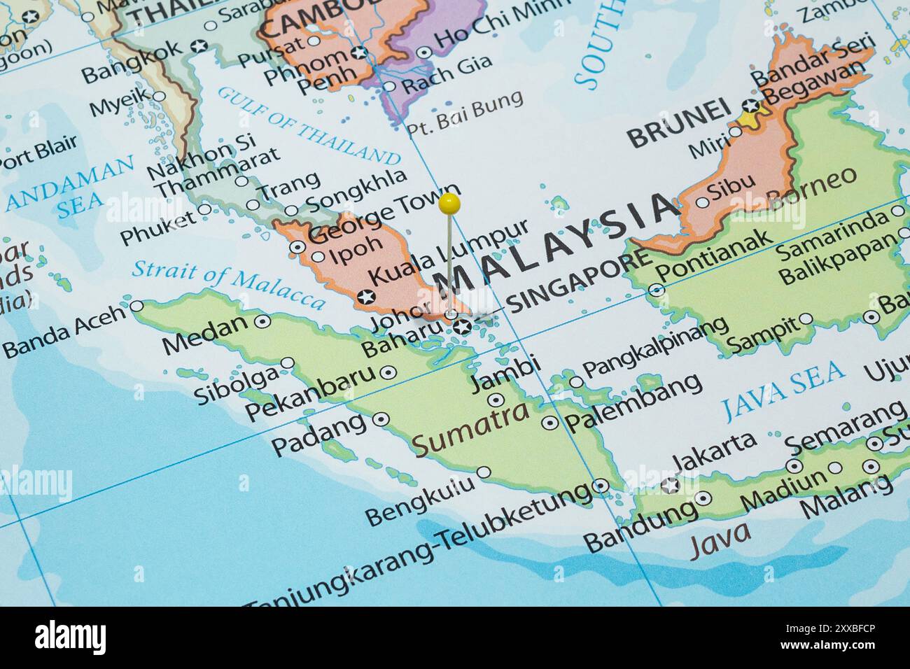 Close up to a Johor Bahru city with a yellow pin needle into Malaysia ...