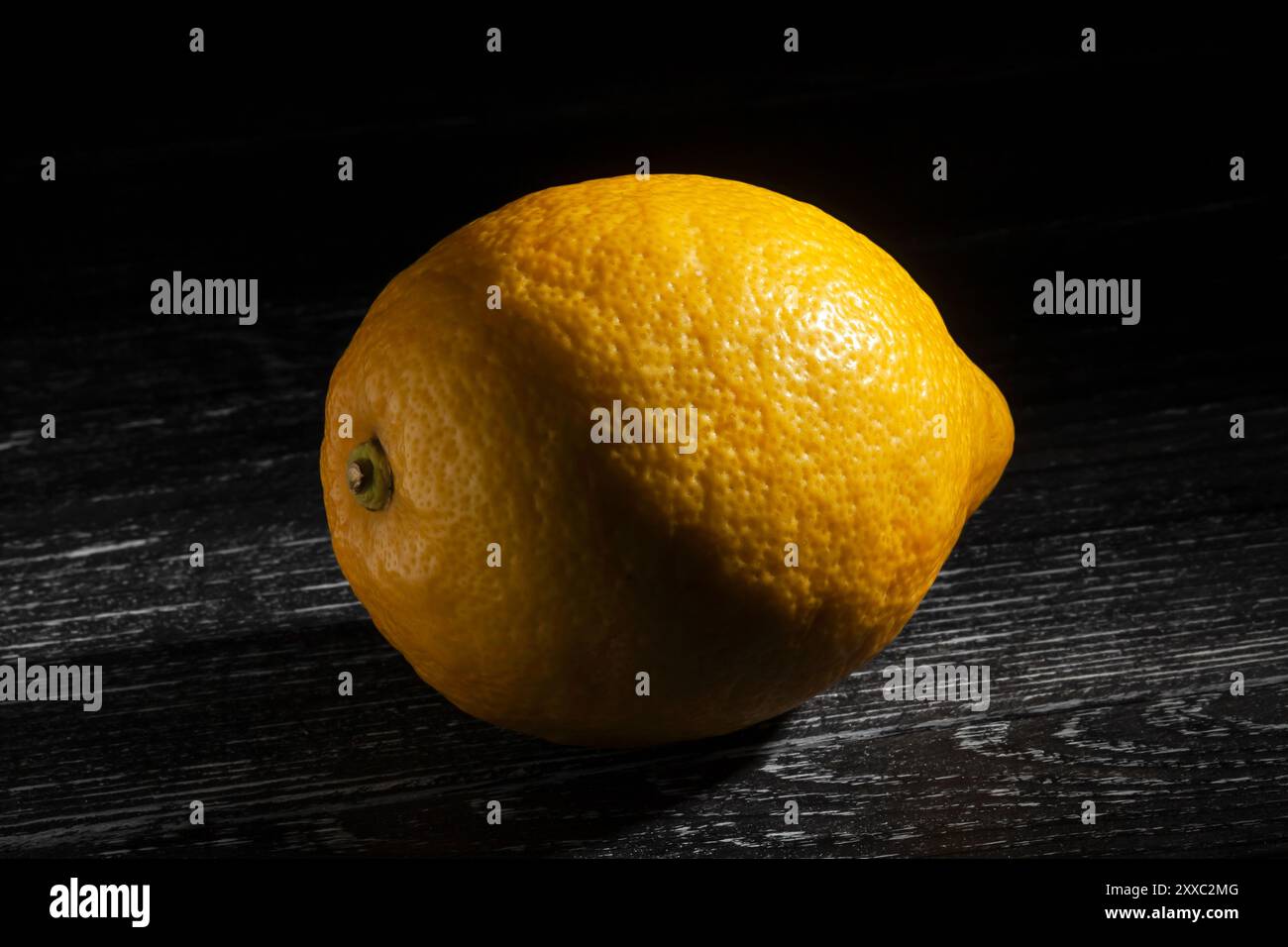 lemon on black wood background Stock Photo