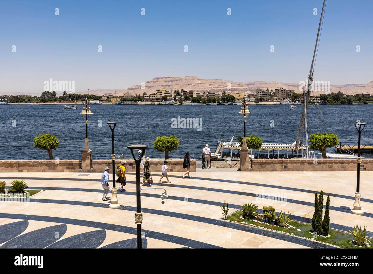 East bank of the Nile, riverside park with ports, downtown, city center, Luxor, Egypt, North Africa, Africa Stock Photo