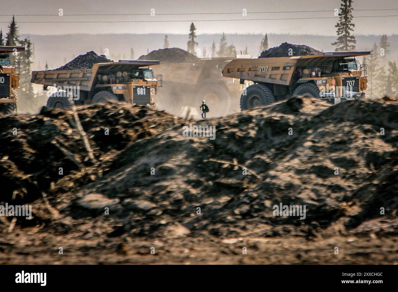 Excavation of oil sand at one of the oil sand mines in Fort McMurray in ...