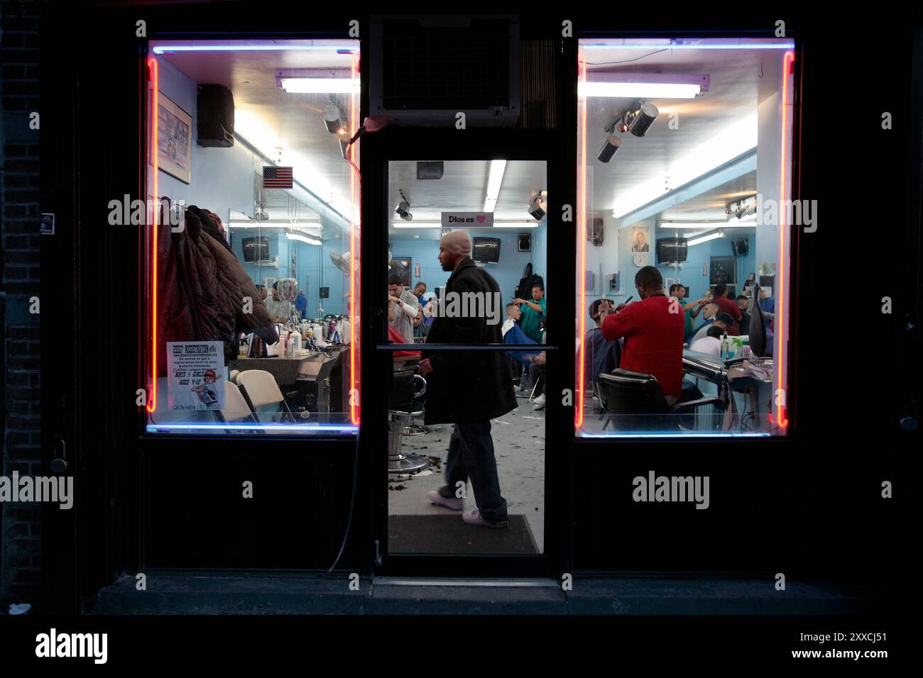 The life in Williamsburg. A Barber Shop open late Stock Photo Alamy