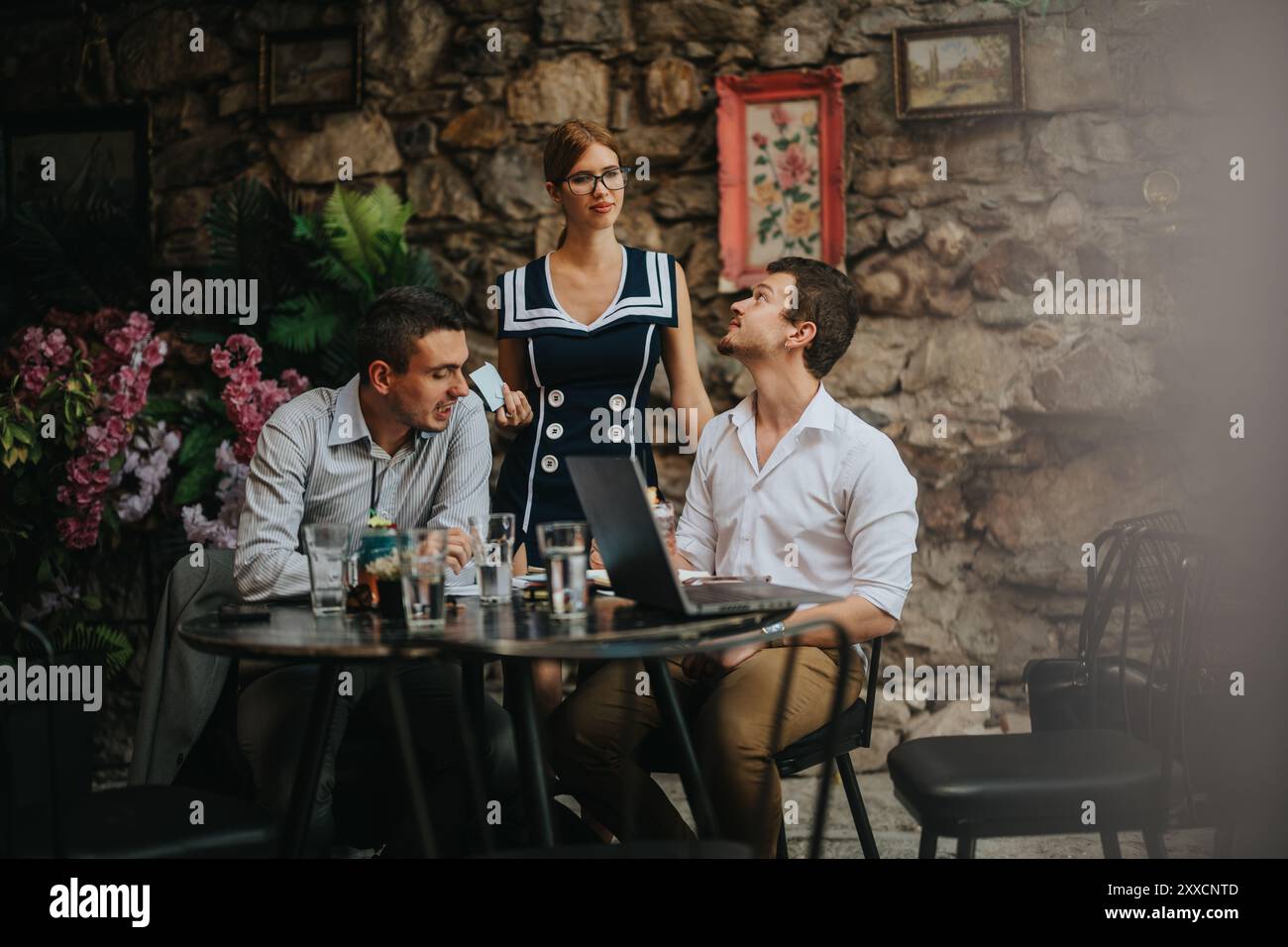 Colleagues engaging in a collaborative outdoor team meeting Stock Photo