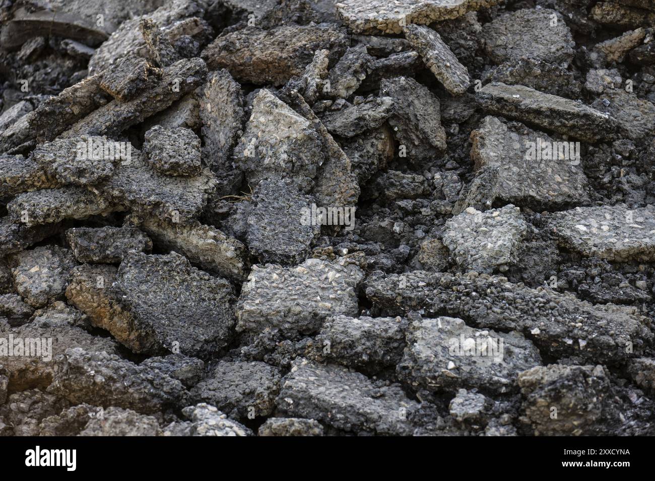 Broken up old asphalt in a pile Stock Photo
