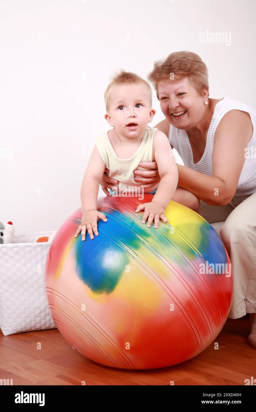 Little boy has fun with the exercise ball Stock Photo - Alamy