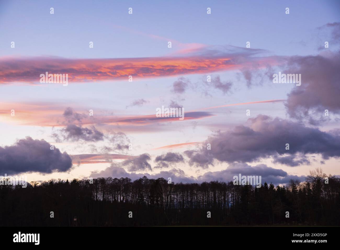 Dramatic sunset coloured sky with dark clouds hi-res stock photography ...