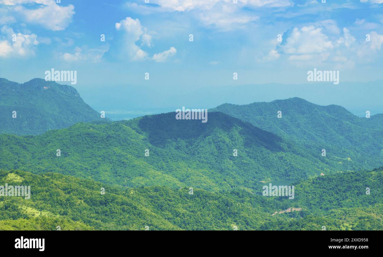 Green mountain with blue sky and clouds background Stock Photo - Alamy