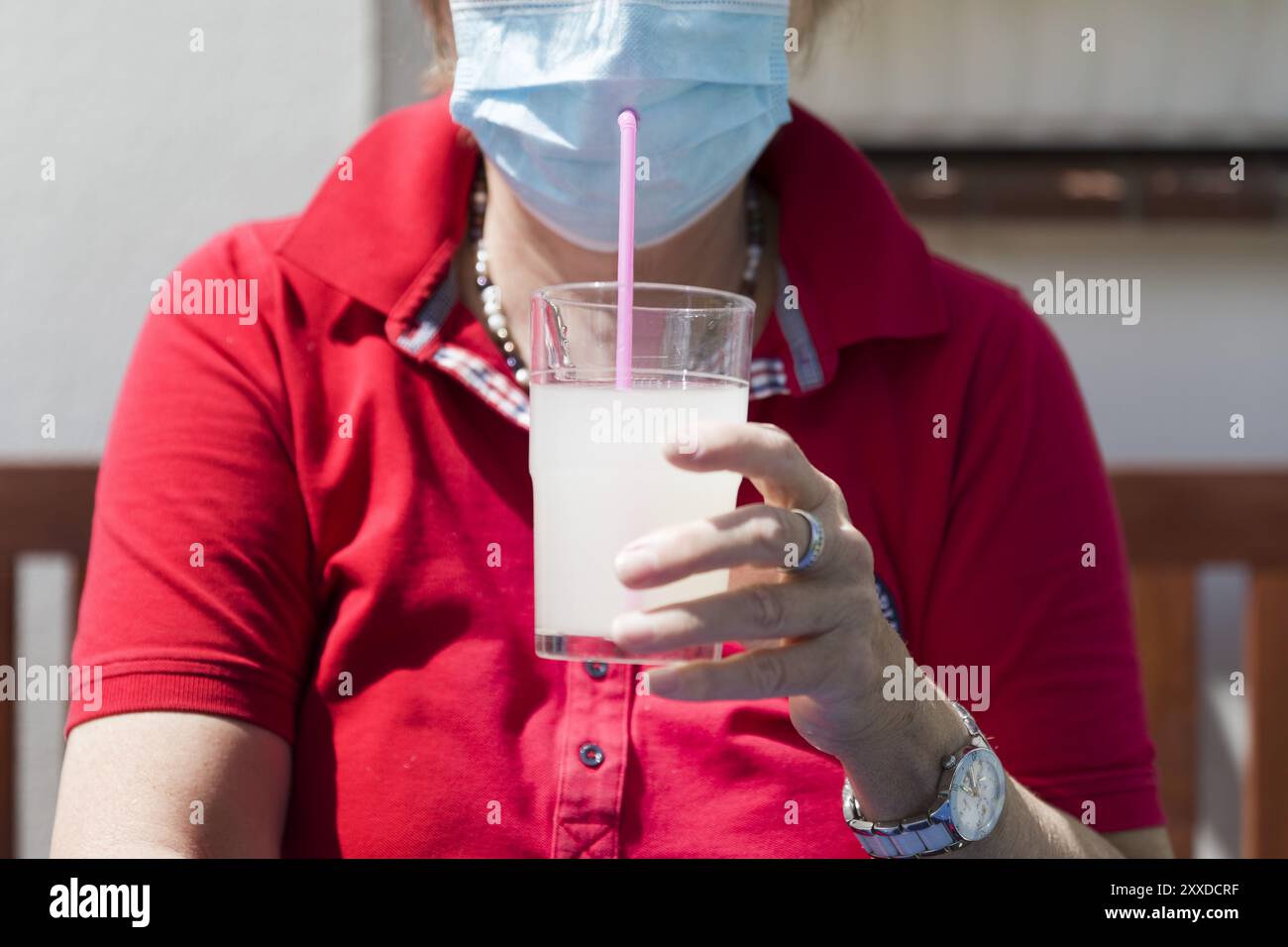 Drinking through mask hi-res stock photography and images - Alamy