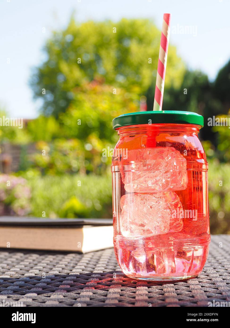 Fresh organic strawberry juice on a garden table Stock Photo - Alamy