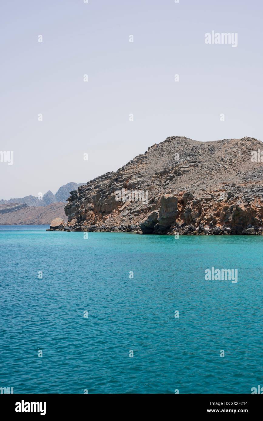 Cliffs and sea in the wild fjord-like of Musandam peninsula, Sultanate of Oman Stock Photo