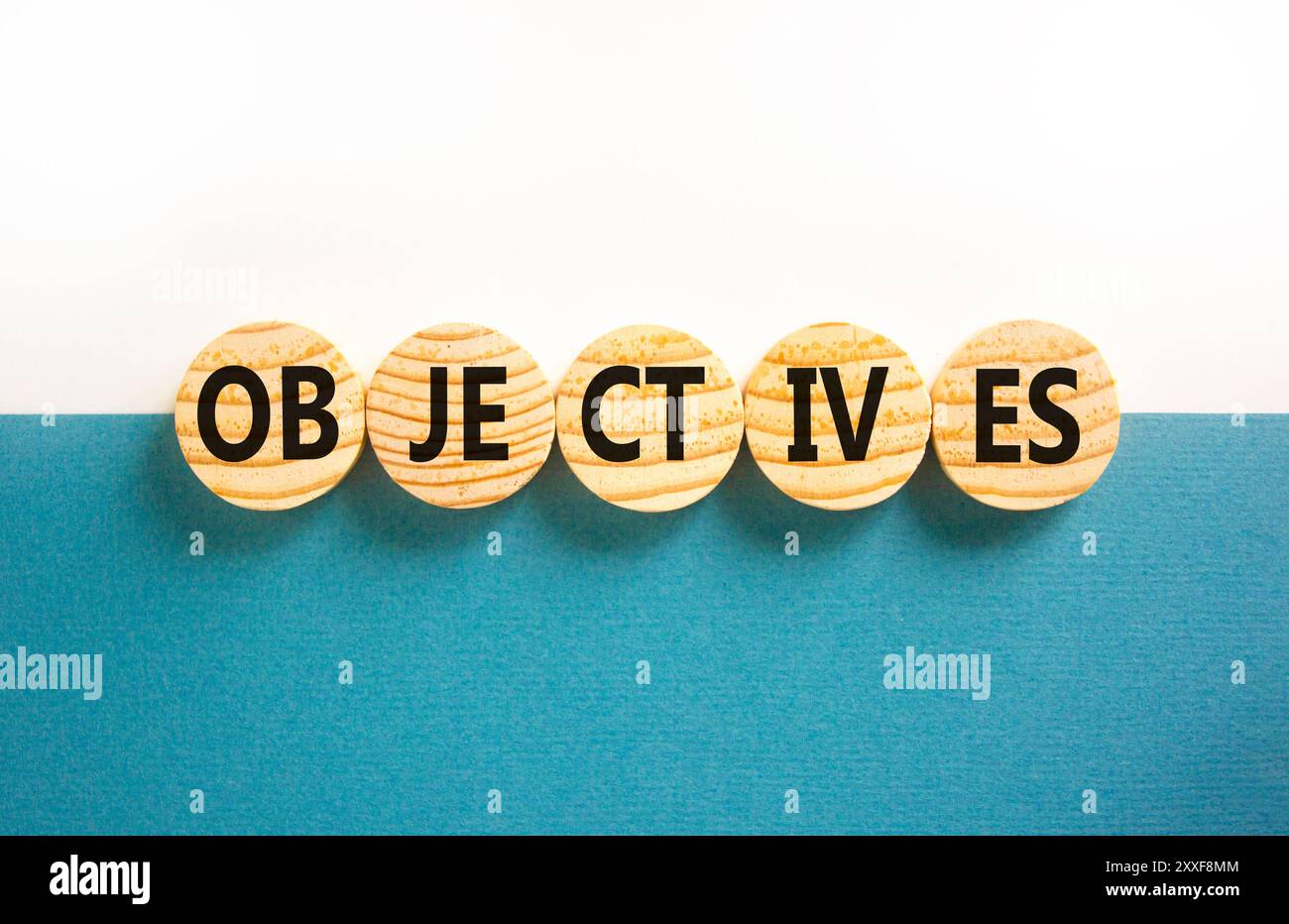 Objectives symbol. Concept word Objectives on beautiful wooden circles ...