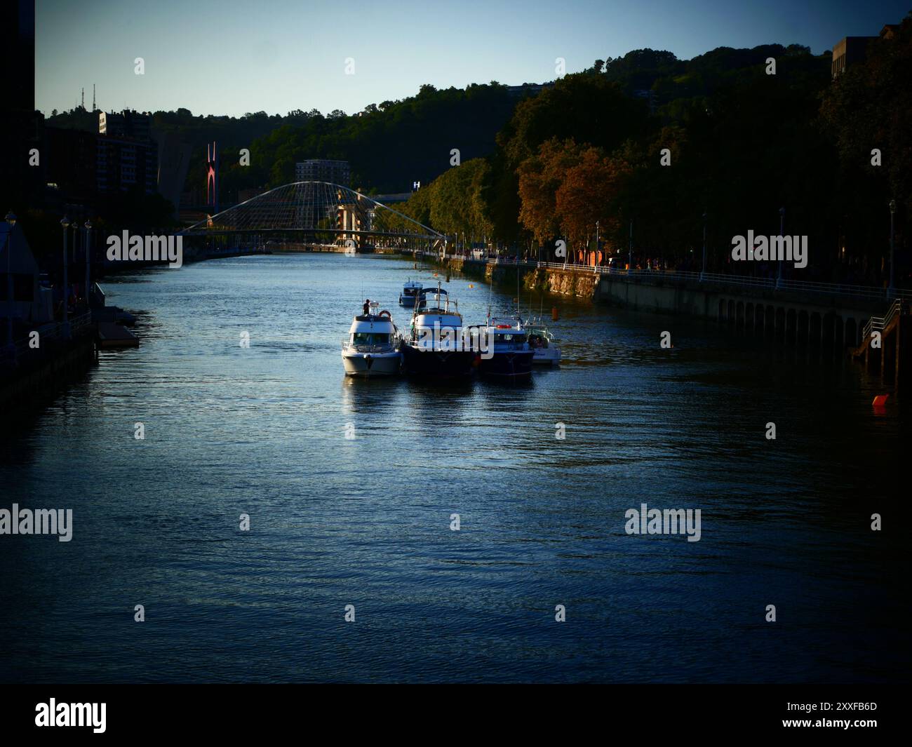 The pleasure boats, unusual sight in Bilbao, patiently await the start of the fireworks, which will begin three hours later. Stock Photo