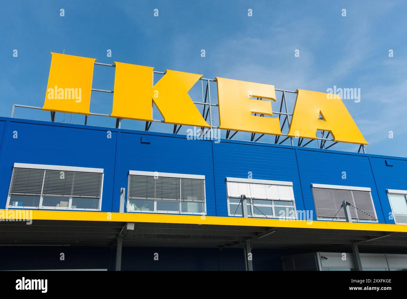 Logo Ikea sign against blue sky Stock Photo