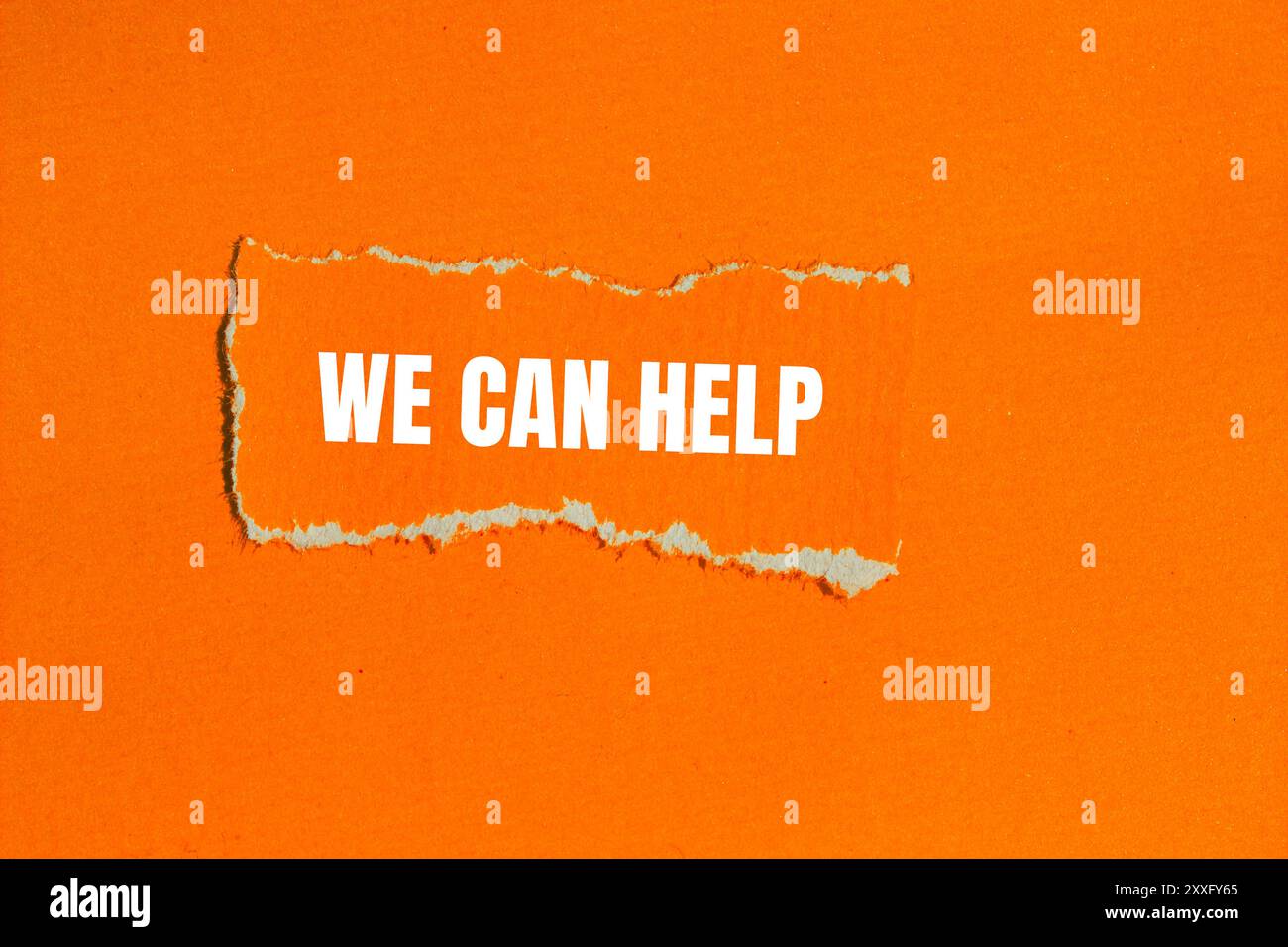 We can help message written on ripped torn orange paper with orange ...