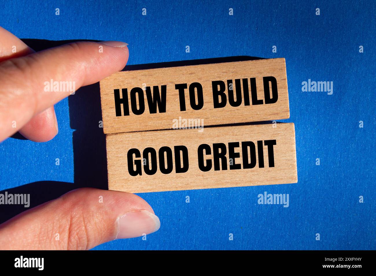 How to build good credit message written on wooden blocks with blue ...