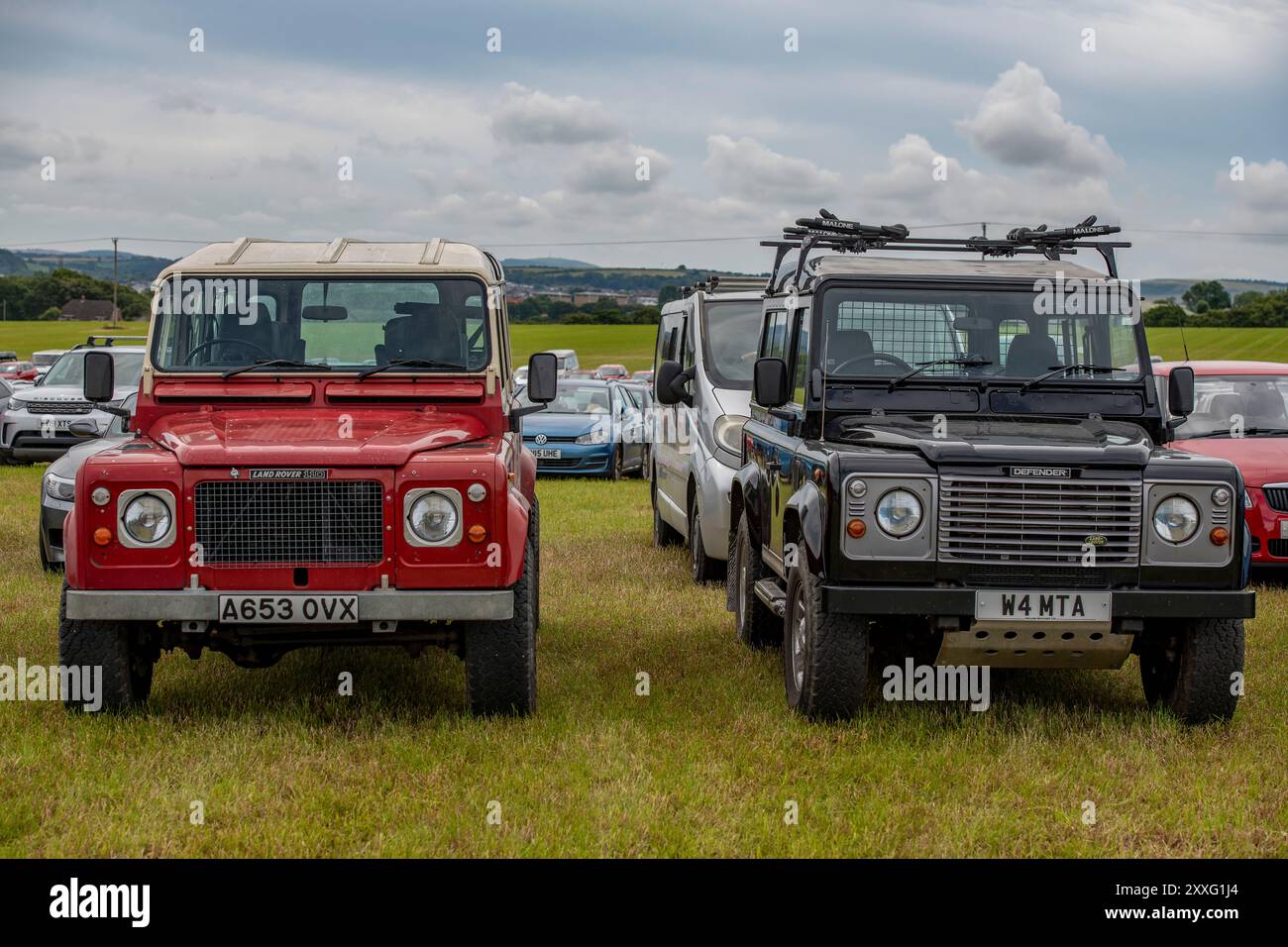 two land rover off-road four-wheel drive vehicles one old and one new ...
