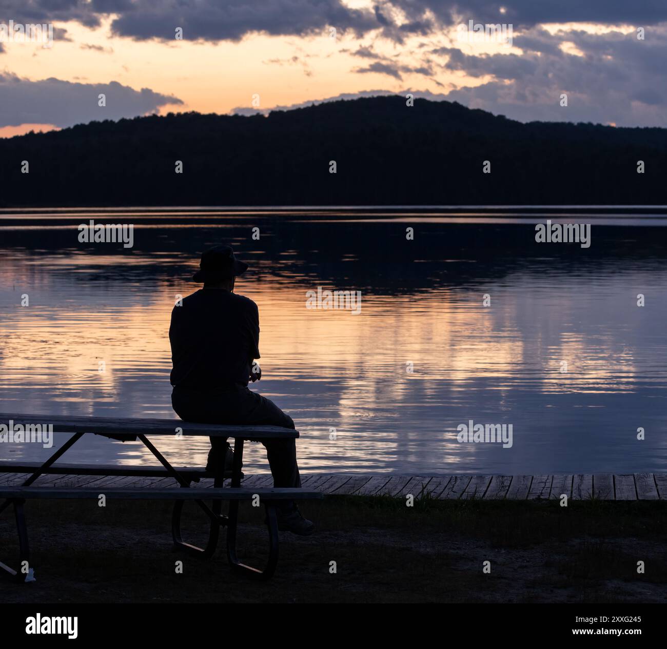Silhouette man watching sunset in hi-res stock photography and images ...