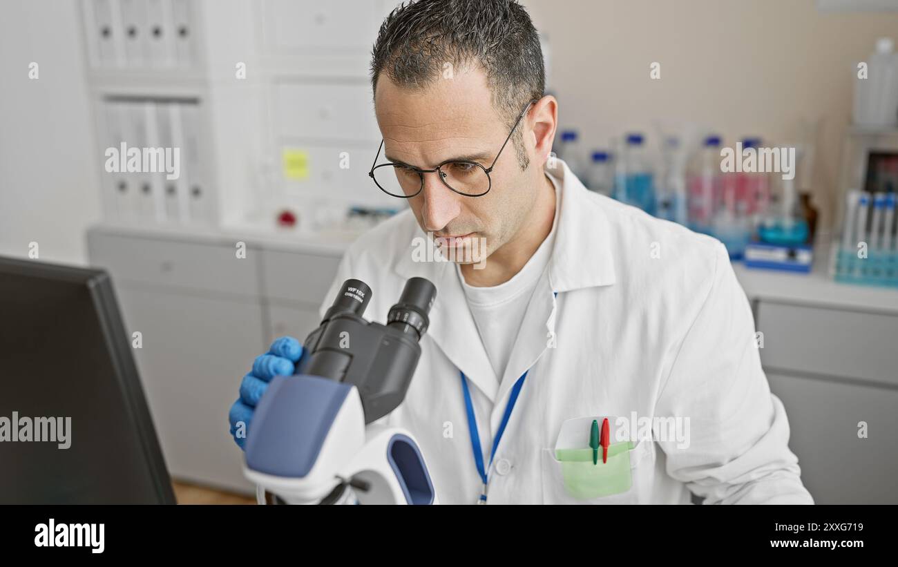 Analyzing researcher wearing blue hi-res stock photography and images ...