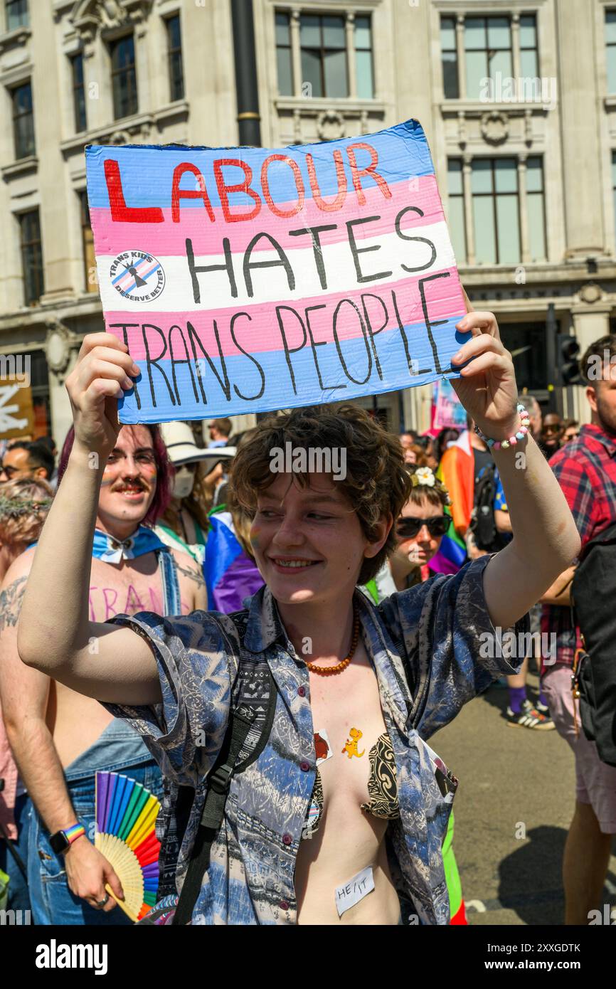 Marchers on the London Trans+ Pride march advocating for greater ...