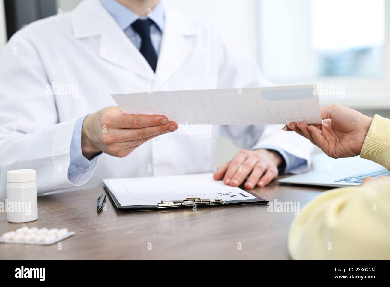 Doctor giving prescription hi-res stock photography and images - Alamy