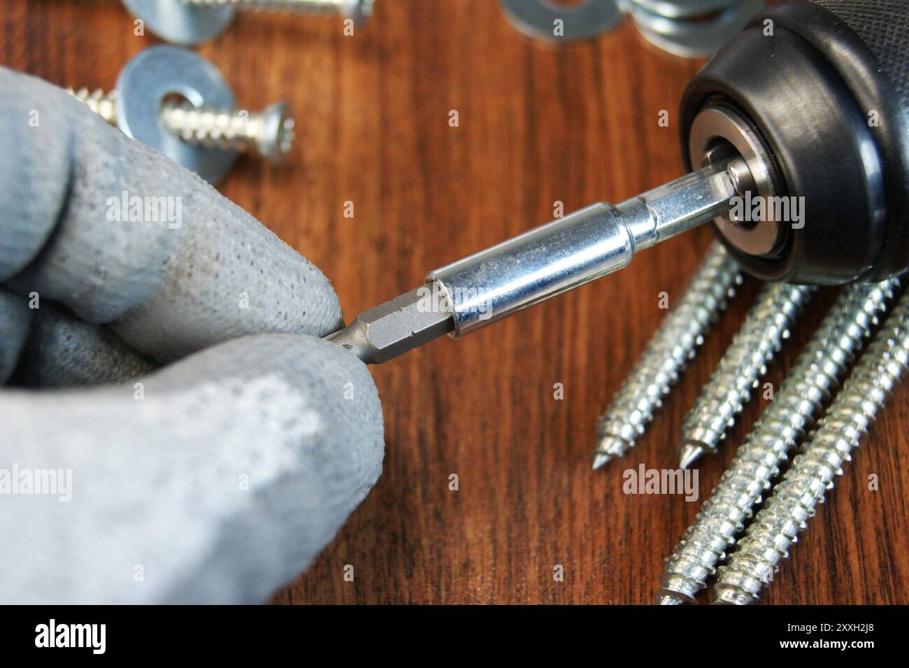 Removing the Torx bit from the bit adapter. Assembler's work process ...