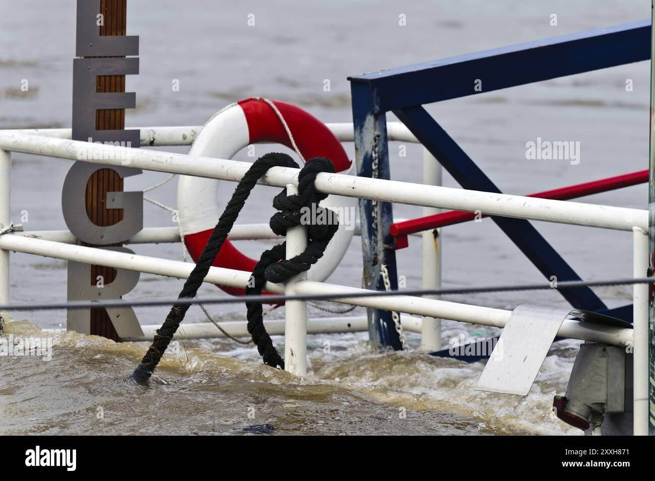 Railing of a pontoon with lifebuoy Stock Photo - Alamy