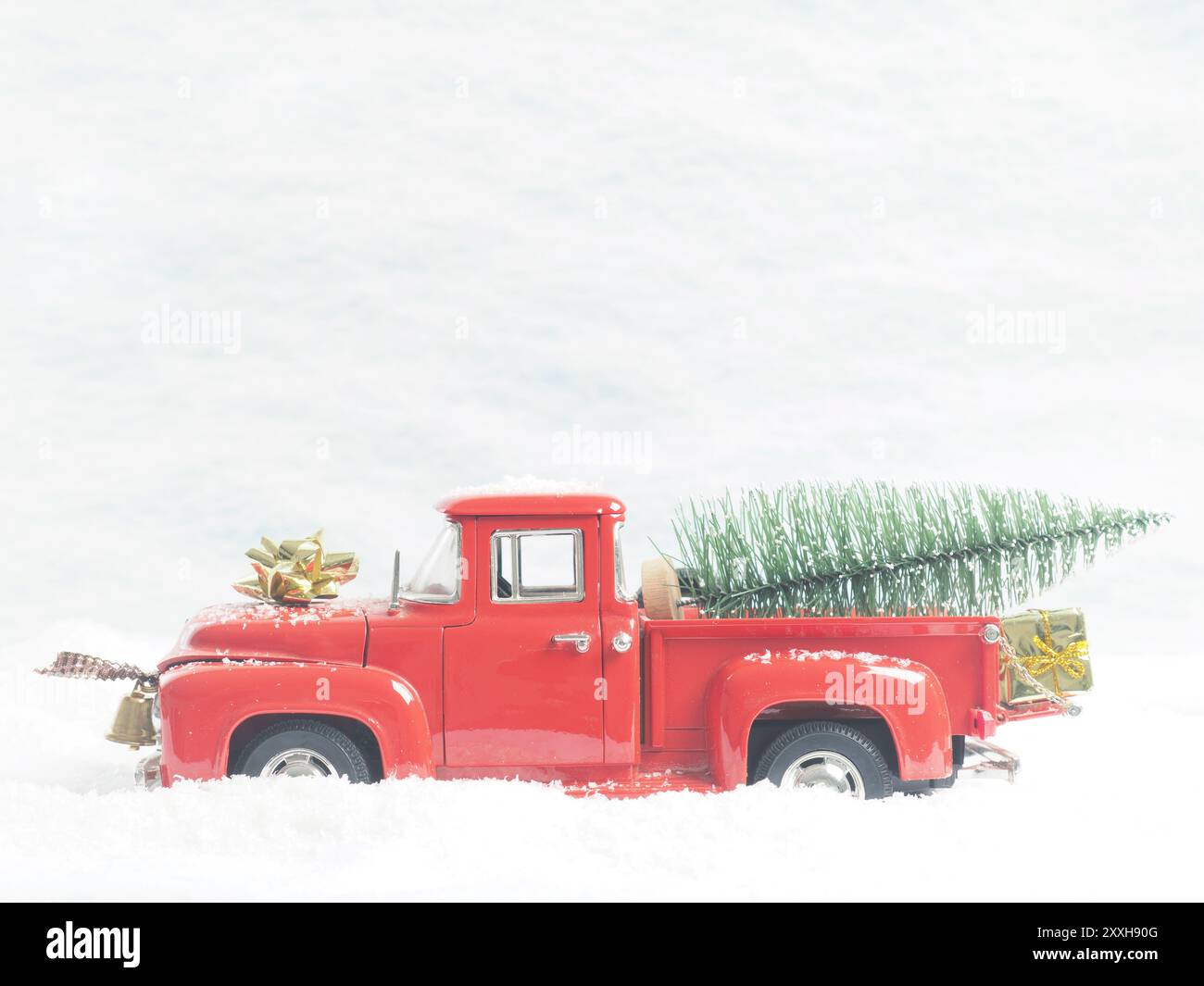 Red vintage pickup truck with a Christmas tree in winter landscape ...