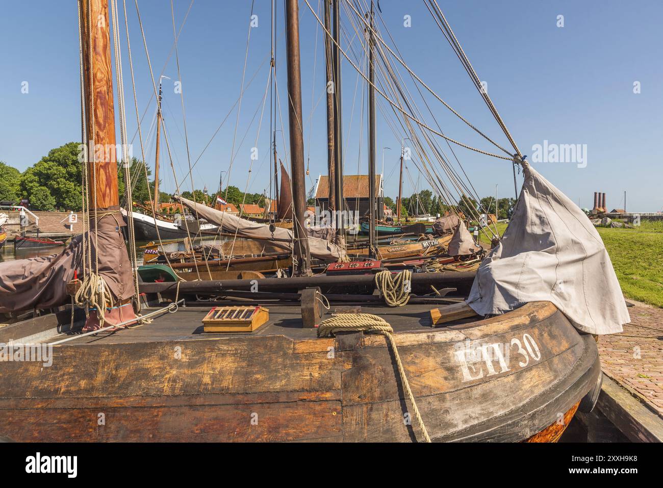 Enkhuizen, Netherlands, June 2022. Old flat-bottomed sailing ships in the harbor of the Zuiderzee Museum in Enkhuizen. Selective focus Stock Photo