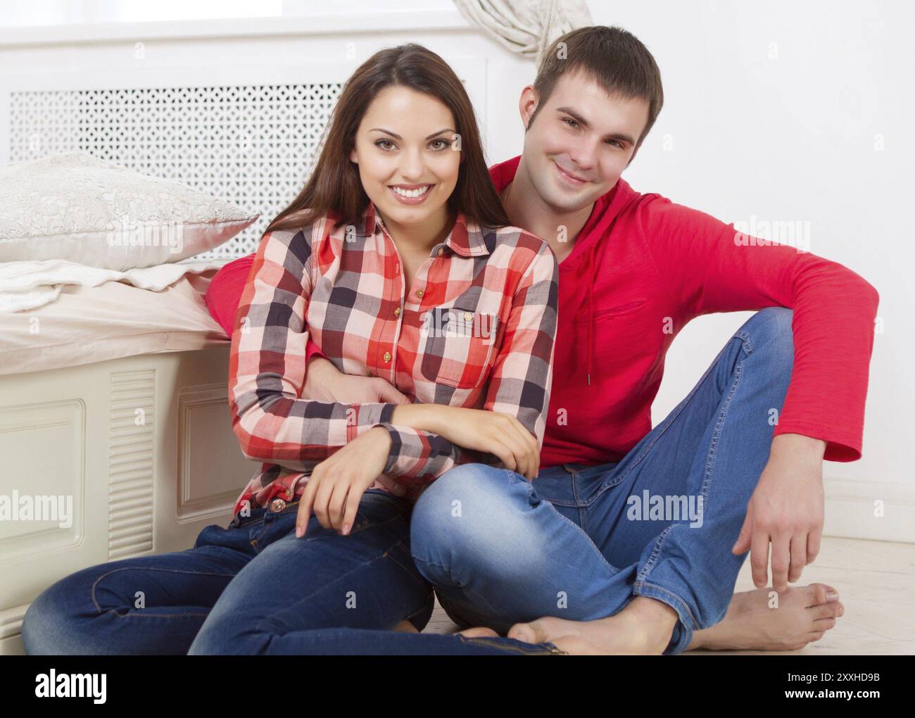 Couple in love at home relaxing on the floor Stock Photo