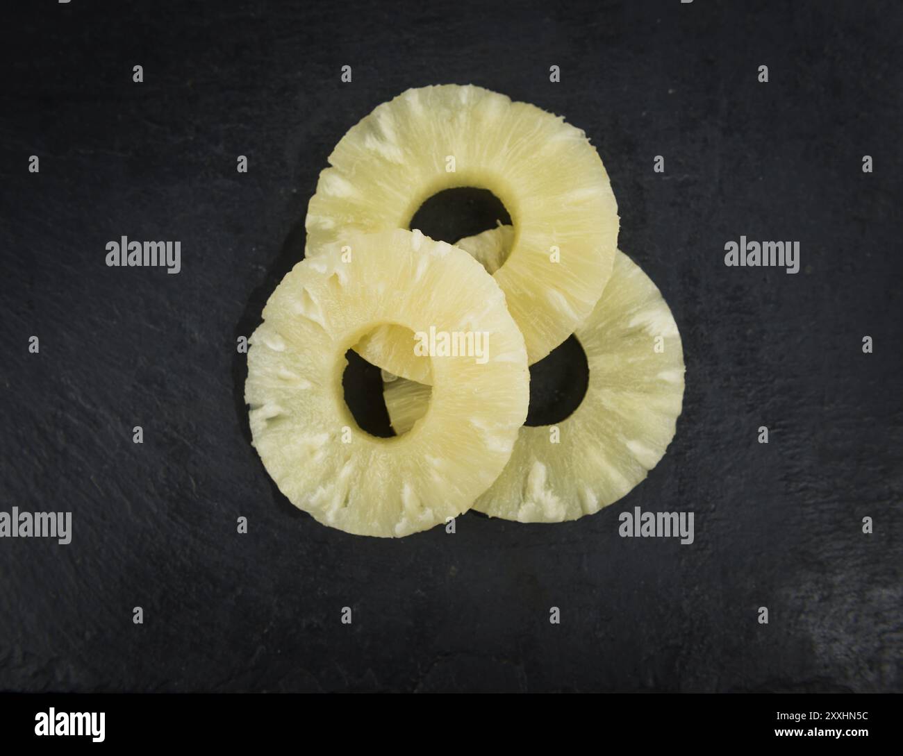 Fresh made Preserved Pineapple Rings on a vintage background as ...