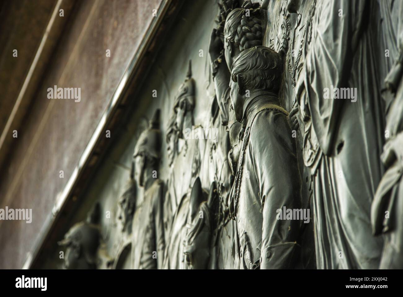 Bronze relief depicting the back of a man's head Stock Photo - Alamy