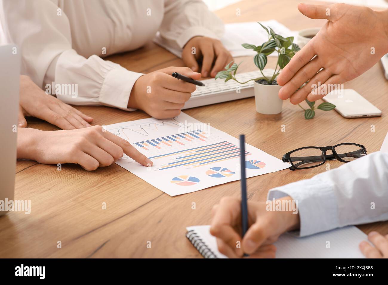 Business team working with documents during meeting in office, closeup ...