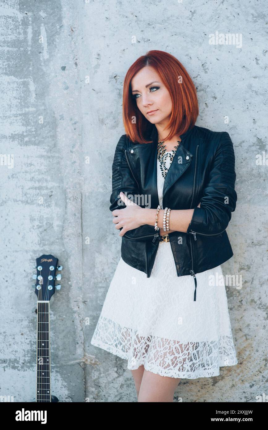 musician young girl with red hair with an acoustic guitar Stock Photo ...
