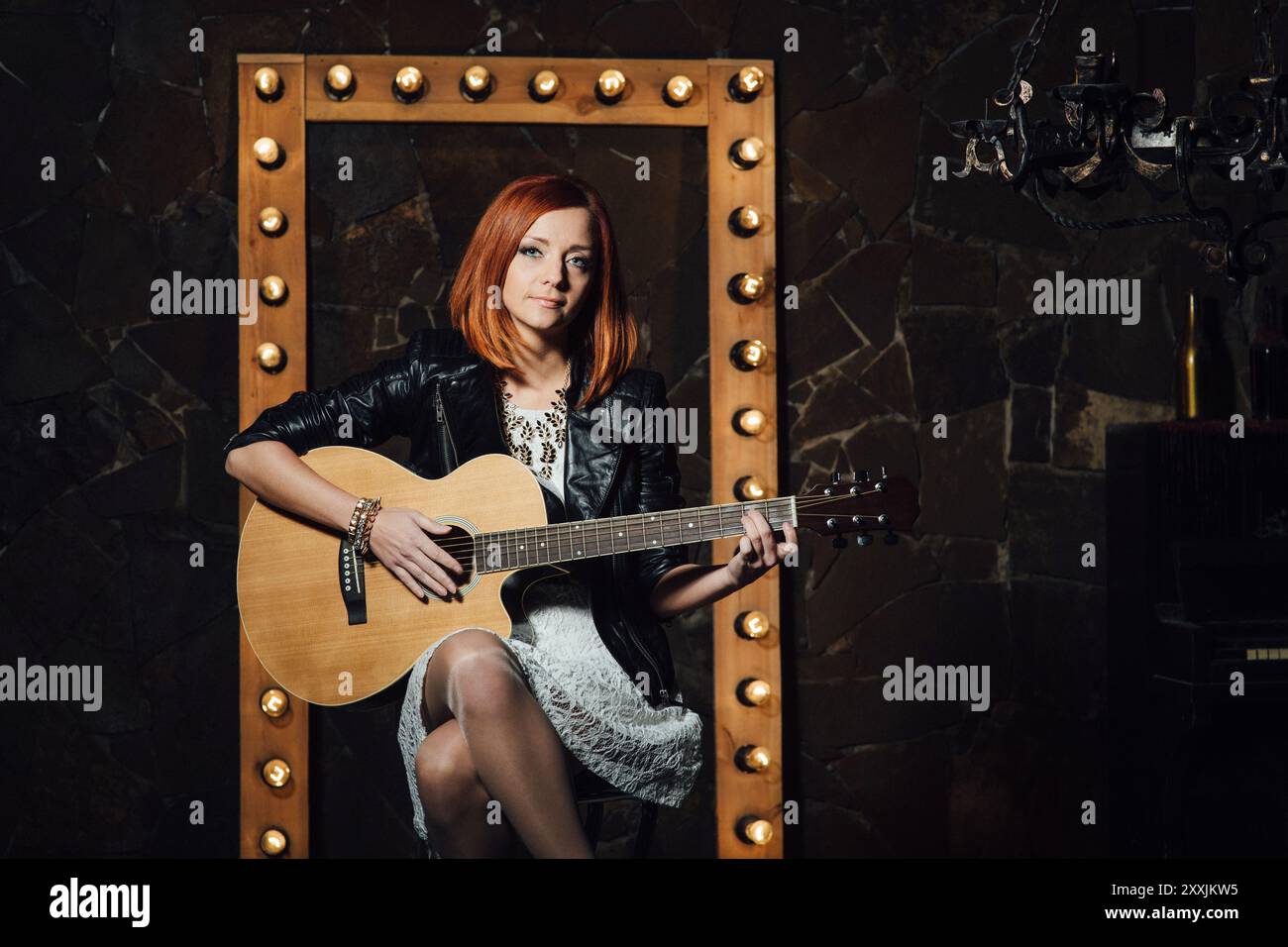 musician young girl with red hair with an acoustic guitar Stock Photo ...