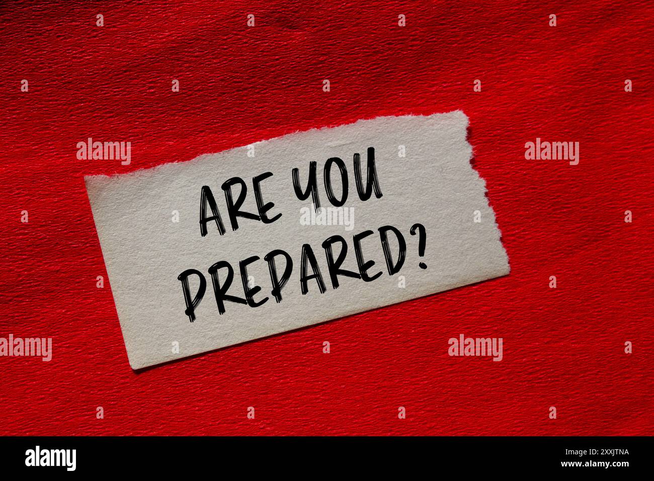 Are you prepared question written on ripped torn paper piece with red(01)