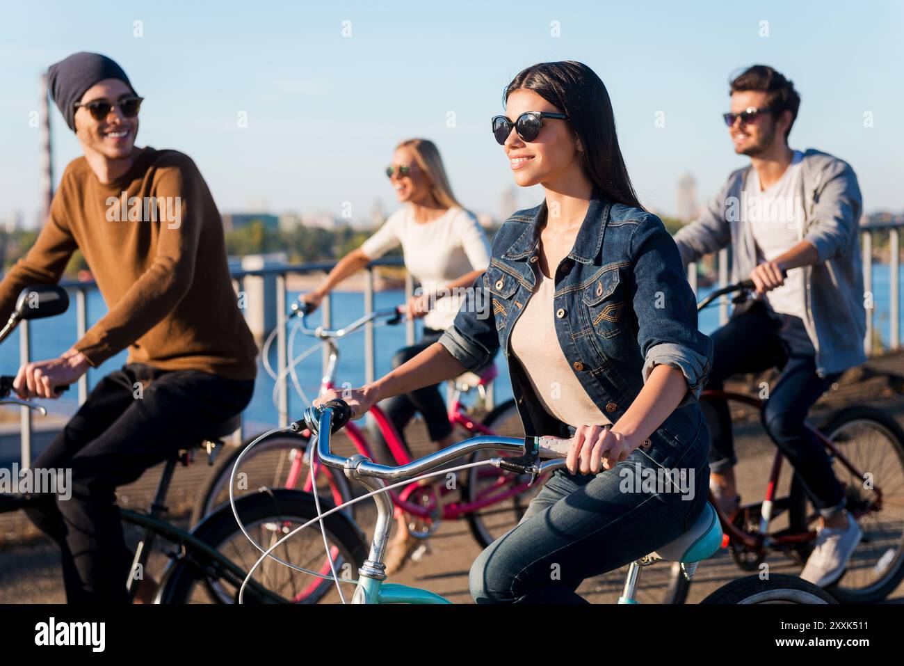 Four young friends cycling hi-res stock photography and images - Alamy