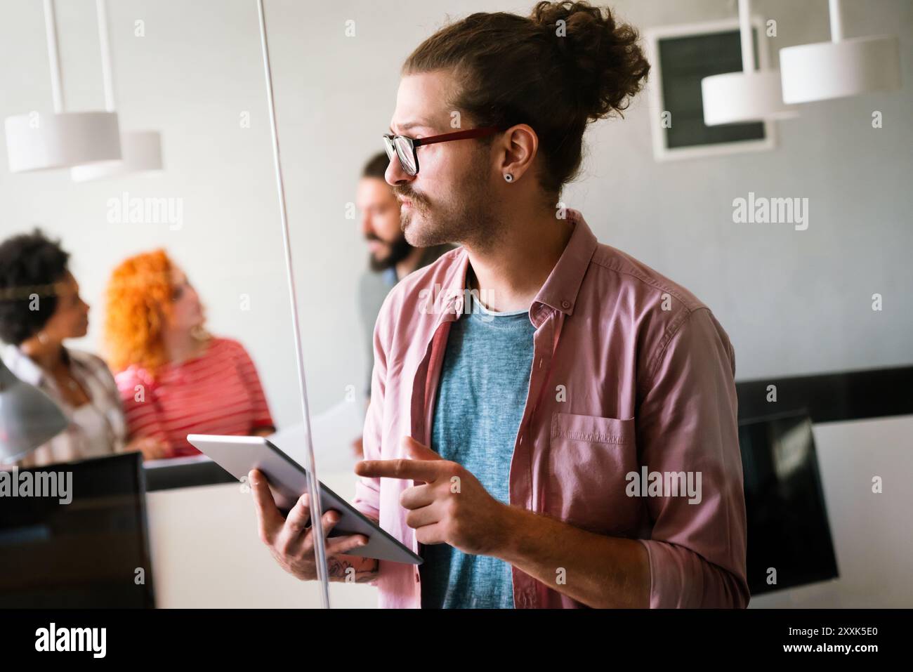 Happy software developers working on meeting, Programming advanced code artificial intelligence. Stock Photo