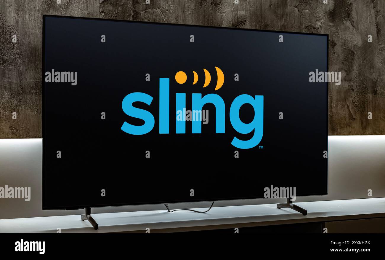 POZNAN, POL - DEC 19, 2023: Flat-screen TV set displaying logo of Sling TV, is an American over-the-top internet television service owned by Dish Netw Stock Photo