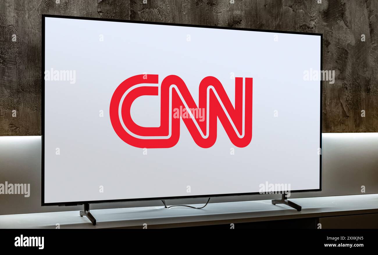 POZNAN, POL - JUL 31, 2024: Flat-screen TV set displaying logo of CNN, a multinational news channel and website operating from Midtown Atlanta, Georgi Stock Photo