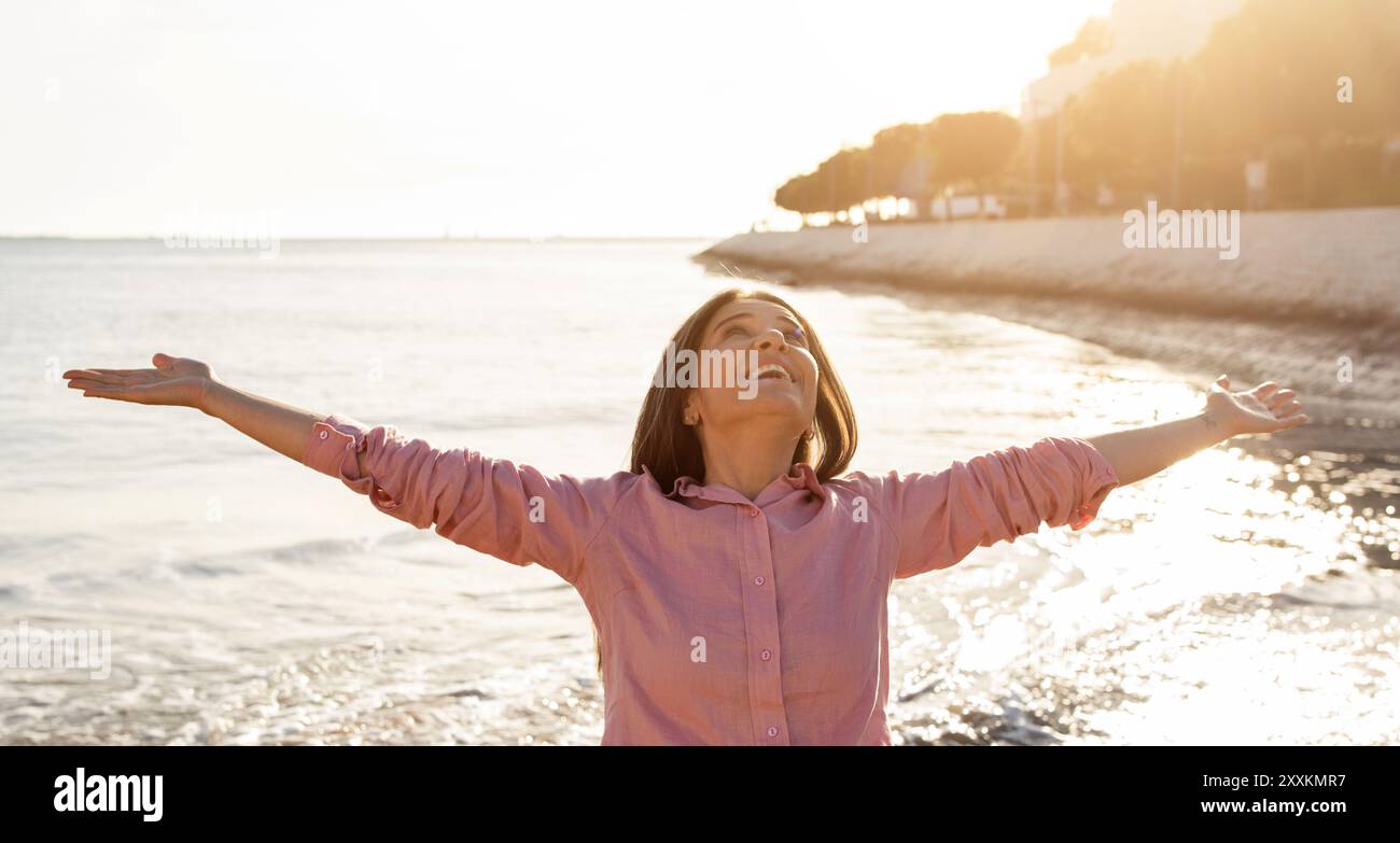 Mature woman beach arms hi-res stock photography and images - Alamy